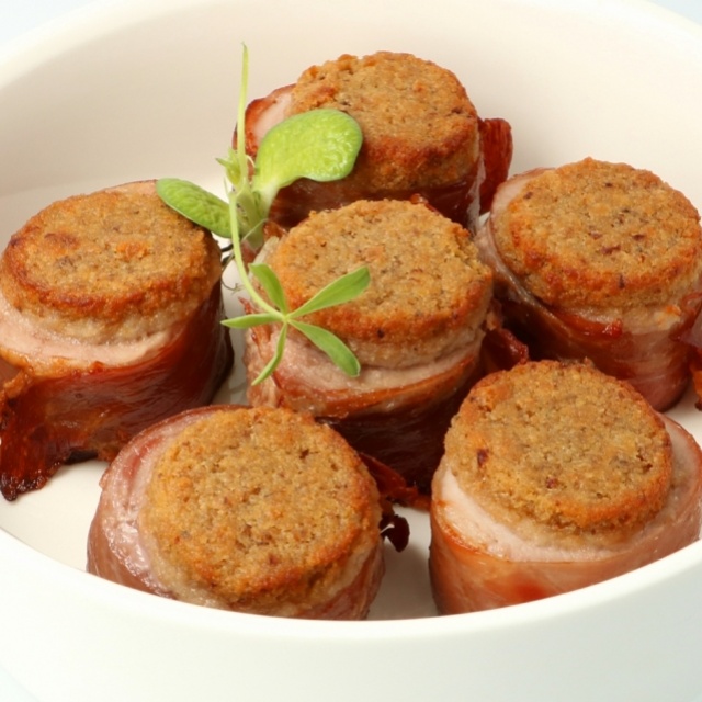 Pork tenderloin cooked in herb oil with a wild mushroom crust 