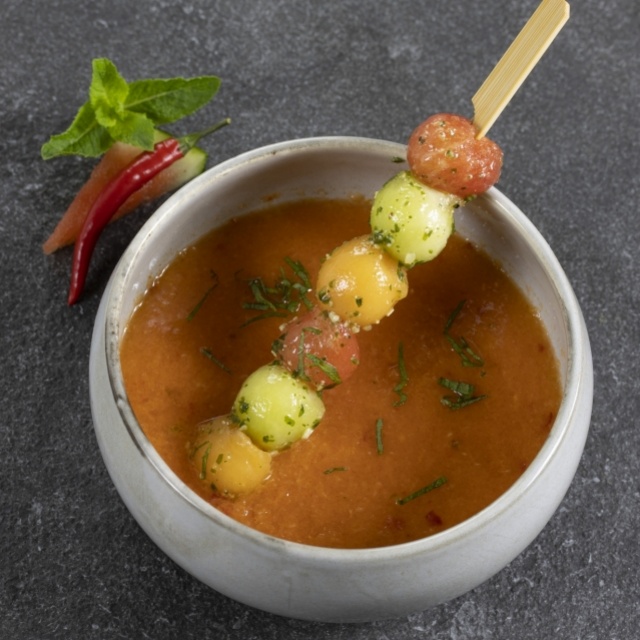 Watermelon soup with marinated melon and ramsons 