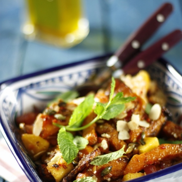 Pumpkin-mango salad with feta cheese, mint and tomato